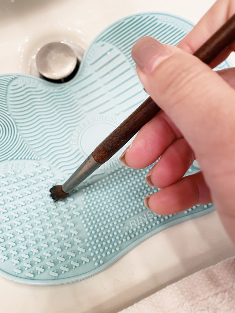 washing an eye brush